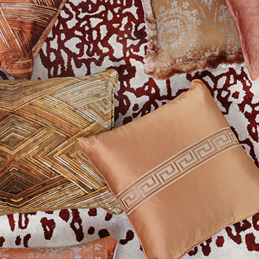 The dash of color that combines the routes of YUPIK Rug with the patterns of the orange color schemed pillows is ready to add cultural elements to any home decor.